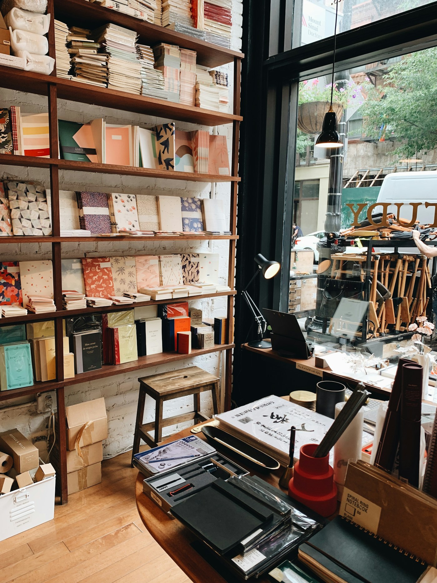 Warm shelves of stationery and notebooks